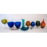 A collection of art glass and oversized coloured glasses, including Murano glass fish etc.