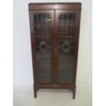 An Edwardian mahogany glazed display cabinet, marked 'Aw-Lyn', length 84cm, height 181cm.