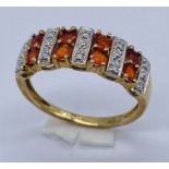 A gem and diamond set dress ring set in 9ct gold