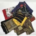 A collection of vintage scarves including a Lucien Lelong silk "Indiscret" scarf