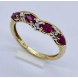 A ruby and diamond 7 stone ring set in 9ct gold