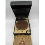 A vintage portable Decca 50 gramophone along with a selection of records