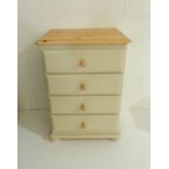 A painted pine chest of four drawers.