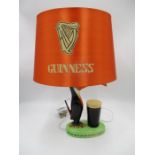 An original Carlton Ware Guinness Toucan advertising lamp with "If he can say as you can, Guinness