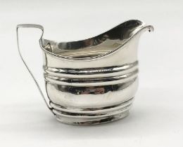 A hallmarked silver cream jug, London 1834, weight 106g