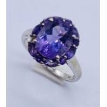 An amethyst cluster ring set in 9ct white gold- 1 stone missing