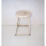 A vintage white painted metal framed stool, with painted wooden seat.