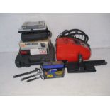 A selection of tools including a Power Devil electric staple, a Black and Decker auto scrolling saw,