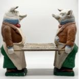 A vintage shop advertising stand with two painted plaster pigs holding a tray 54cm x 64cm