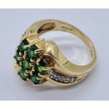 A tourmaline and diamond dress ring set in 14ct gold, total weight 6.4g