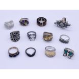 A collection of 925 silver rings including tigers eye, lapis lazuli etc.