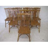 A set of eight matching American style chairs with crinoline stretchers.