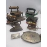 A collection of antique and vintage flat irons