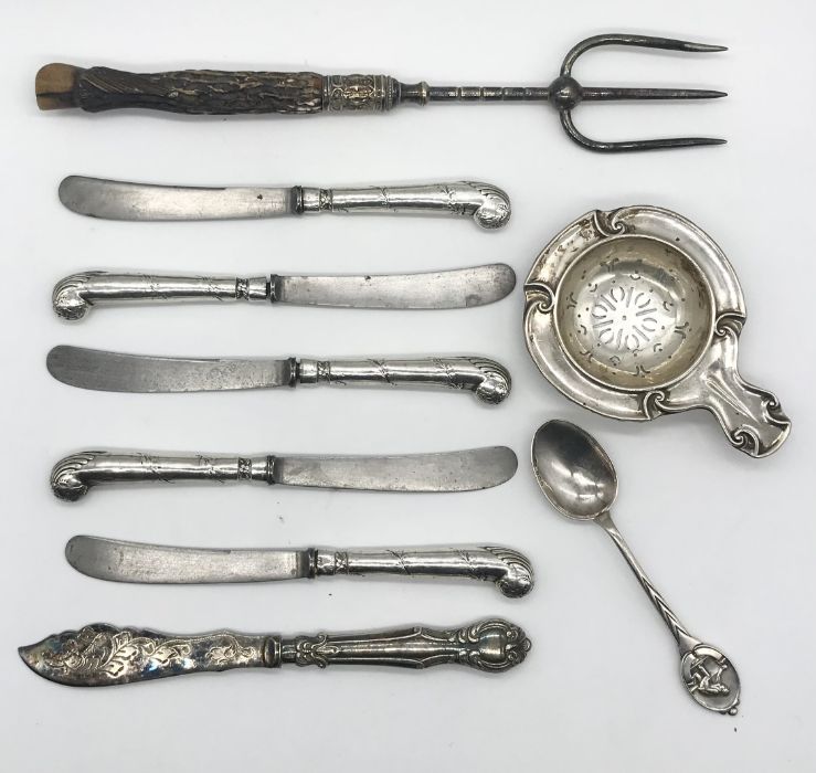 A hallmarked silver strainer, Victorian muffin fork with carved horn handle in the form of a hoof,