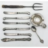 A hallmarked silver strainer, Victorian muffin fork with carved horn handle in the form of a hoof,