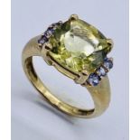 A 9ct gold dress ring set with a citrine