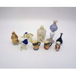 An Oriental painted glass scent bottle, along with three miniature toby jugs, some Royal Doulton,