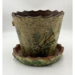 A studio pottery plant pot and tray in the form of a tree trunk