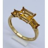 A 9ct gold citrine three stone ring