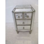 A mirrored bedside cabinet, with four drawers, length 49cm, height 78cm.