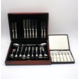 A George Butler canteen of stainless steel cutlery, along with a boxed set of Arthur Price stainless