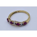 A ruby and diamond 7 stone ring in 9ct gold