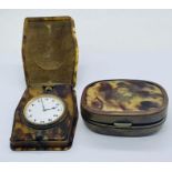 A tortoiseshell snuff box inlaid with brass along with a faux tortoiseshell travel clock