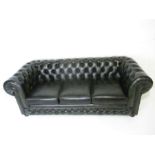 A Thomas Lloyd dark green three seater Chesterfield sofa, length 210cm.