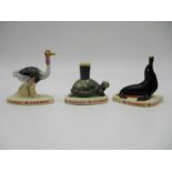 A collection three vintage Carlton Ware ceramic Guinness figures including an ostrich, seal and