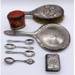 A small collection of hallmarked silver items including brush and mirror, coffee spoons and a common