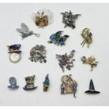 A collection of Kirks Folly brooches including Alice in Wonderland, Fantasy etc.