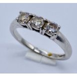 A platinum diamond three stone ring (marked 950) with a total of approx 0.75ct diamonds