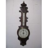 A Victorian carved aneroid barometer