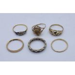 A collection of 9ct gold rings (total weight 9g) along with an 18ct gold ring, weight 1.6g