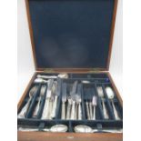 A part canteen of cutlery including two Hallmarked silver coffee spoons, the handles formed as