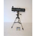 A Celestron AstroMaster 130 astronomers telescope, with adjustable tripod stand, instructions,