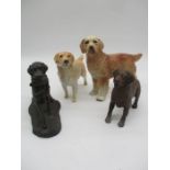 Four dog figurines including Beswick.