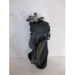 A set of Lynx Black Cat golf irons in carry bag. Clubs include irons three to nine and a pitching