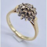 A diamond cluster ring set in 9ct gold