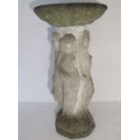 A reconstituted stone bird bath, base features nude figures in a classical style. Height 80cm