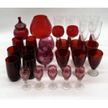 A large collection of vintage ruby glass goblets, beakers, sherry glasses etc.