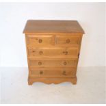 A pine chest of five drawers, length 66cm, height 79cm.