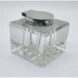 A hallmarked silver topped inkwell, Birmingham 1908