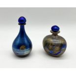 Two Siddy Langley iridescent glass scent bottles (13.5cm & 11cm) one with blue and ochre "