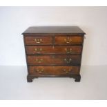 A Georgian oak chest of five drawers, with crossbanding, length 97cm, height 92cm.