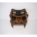 A Victorian rosewood Canterbury, with single drawer.
