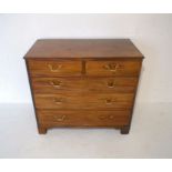 A Georgian mahogany chest of five drawers, on bracket feet, length 98.5cm, height 89cm, depth 51cm.