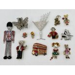 A collection of Butler & Wilson brooches, pin badges and hairclips including cocktail glass,