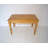A pine kitchen table, length 122cm, height 78cm, depth 75cm.