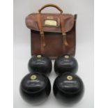 A set of four vintage Crown Green Bowls in vintage Slazenger carry case